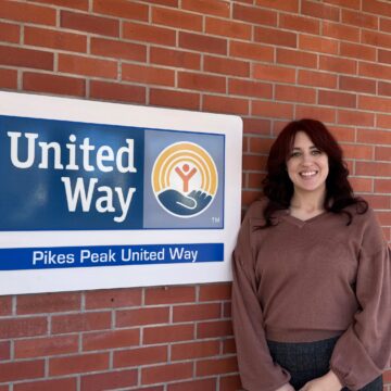 image of Marleigh Edwards next to a pike peak united way sign